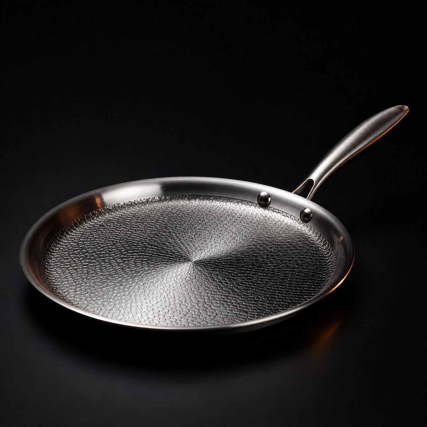 Hand-hammered flat titanium crêpe pan cooking a crêpe, PFAS-free cookware by Okura